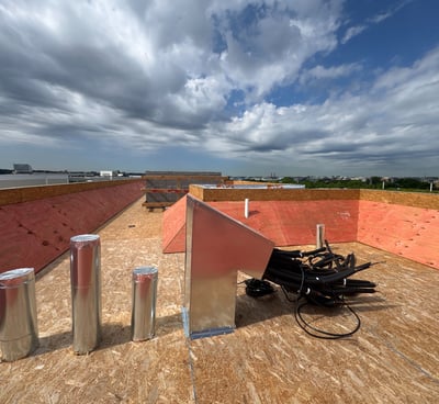 Rooftop framing carpentry with wind bracing for multi-unit residential construction in Washington DC by BBCDC general contrac