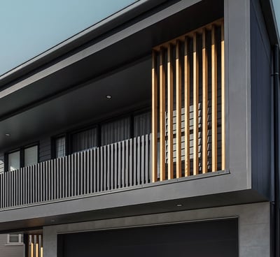 a modern house with a large garage door and a garage door