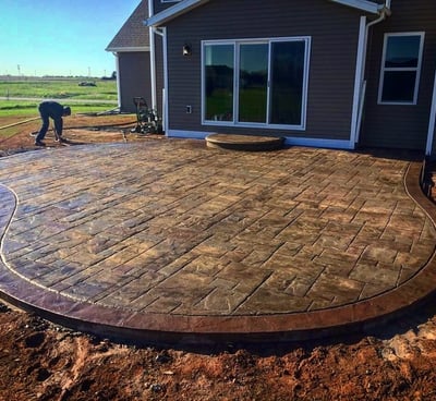 a patio with a brick patio with a brick patio