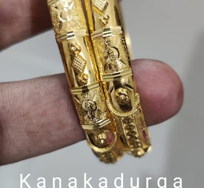 a pair of gold plated bangles