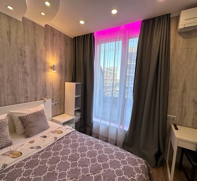 a bed room with a bed and a desk