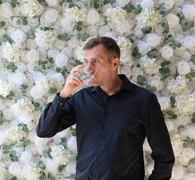 Event backdrop featuring a luxurious white rose flower wall rental in Shakopee, Minnesota