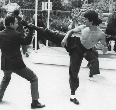 Bruce Lee speed kicking.