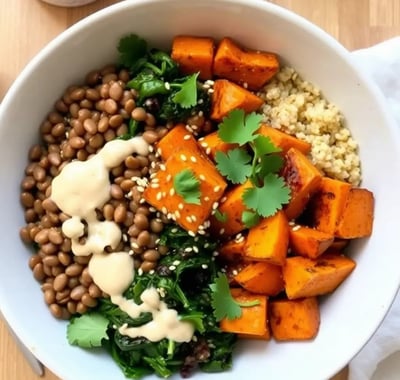 Nourishing lentil and spinach Buddha bowl with creamy tahini dressing