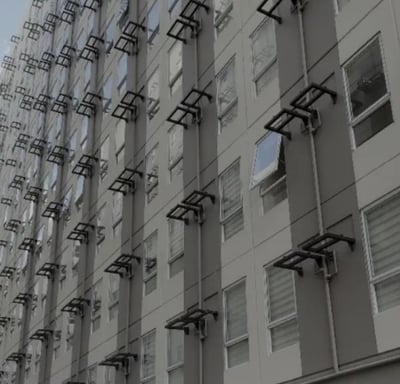 a building with a bunch of windows and a clock on it