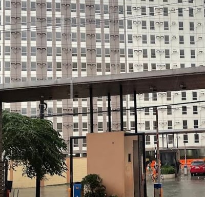 a city street scene with a car parked in front of a building