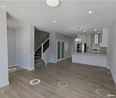 a living room with a staircase and a staircase