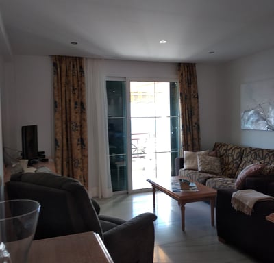 a living room with a couch and a table