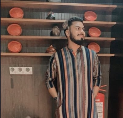a man in a striped shirt and a red and white striped shirt