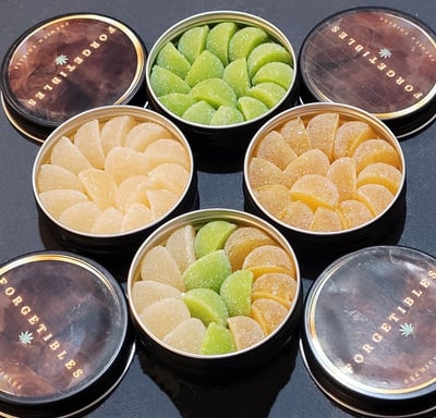 Cannabis gummies packaged in tins.