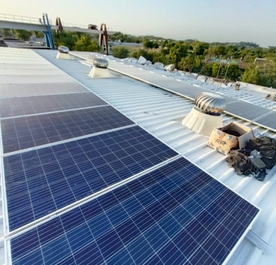 a solar paneled roof with solar panels on a metal roof