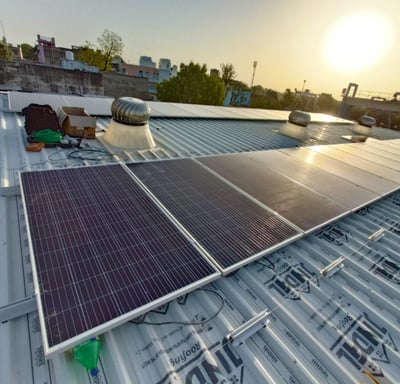 a solar paneled roof with solar panels on a roof