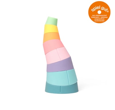 A curved tower made of colorful stacking rings