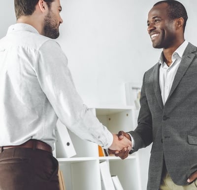 two gentle man shaking hands