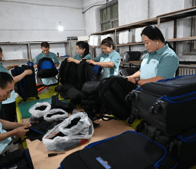 a group of people Do a quality check on the bag