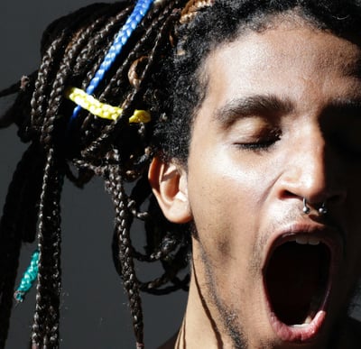 a man with dreadlocks and dreadlocks on his head