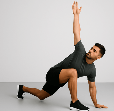 a man in a gray shirt is doing a yoga pose