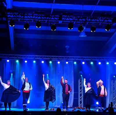 a group of people standing on a stage