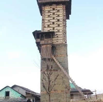 a tall tower with a clock on top of it