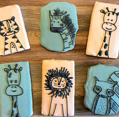 Simply adorable cookies for a kid's birthday party. Cartoon animals on light backgrounds