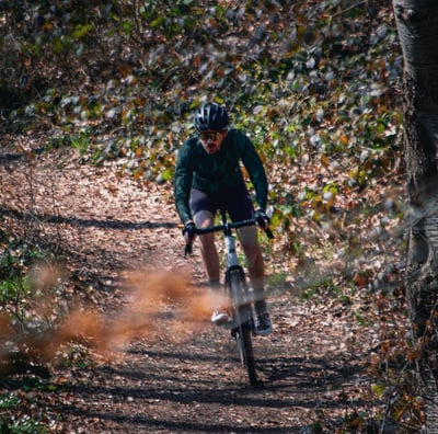 a man riding a bike on a trail