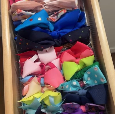 an organized drawer or colorful bows