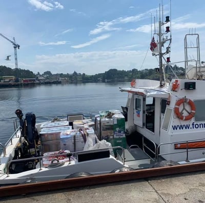 a boat with a large amount of bags on it