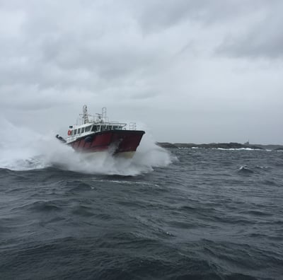a boat in the ocean with a boat in the water