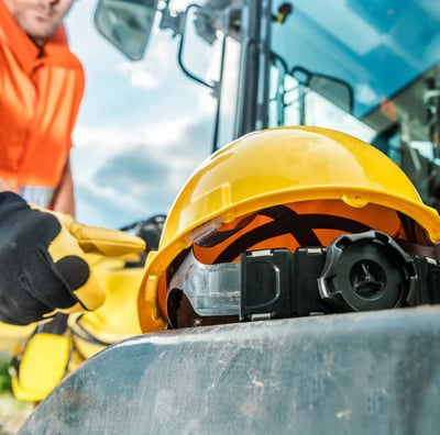 a construction worker in a helmet and safety gear