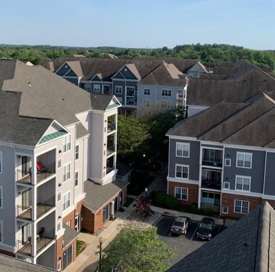 Aerial view of an apartment complex exterior painting project by Garnet Painting & Remodeling in Douglas, GA.
