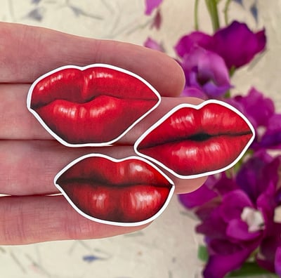 Three red lips vinyl stickers