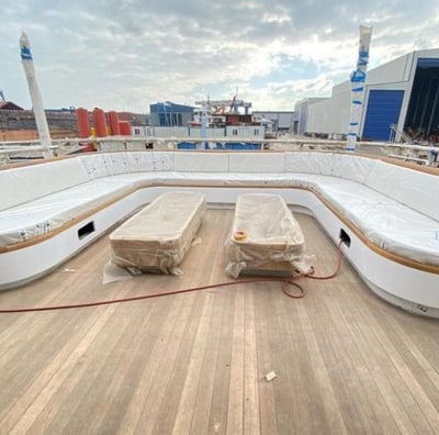 dinc design luxury yacht seating area with outdoor and indoor seating cushions.
