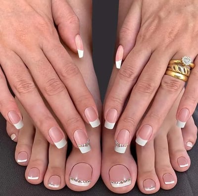 a woman's feet with a wedding ring on her finger