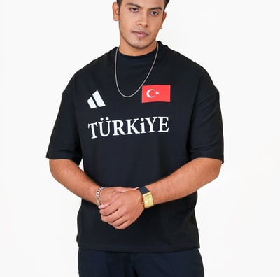 a man in a black shirt and a necklace with a turkish flag