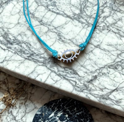 a necklace with a blue cord cord cord cord cord and a necklace with a silver