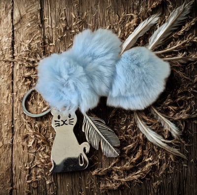 a keychain with a cat on it