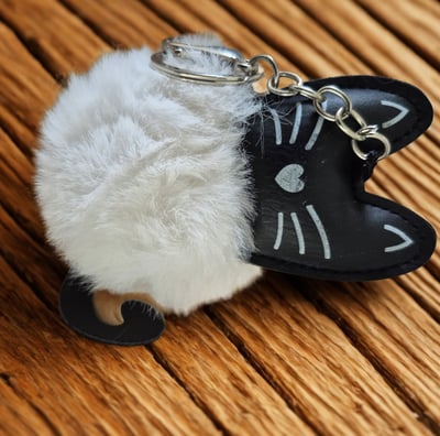 a cat keychain with a cat keychain