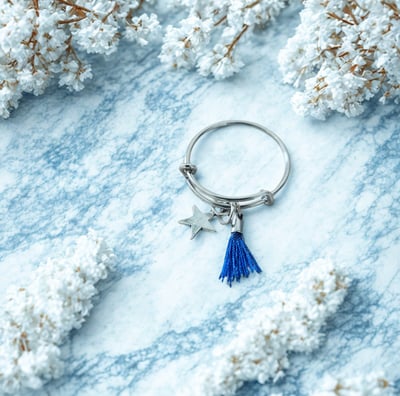 a keychain with a starfish charm on it