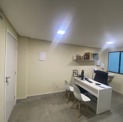 a desk with a laptop and a laptop on it