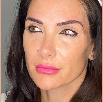 a woman with a pink lipstick and a pink lipstick