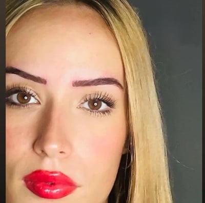 a woman with blonde hair and red lipstick