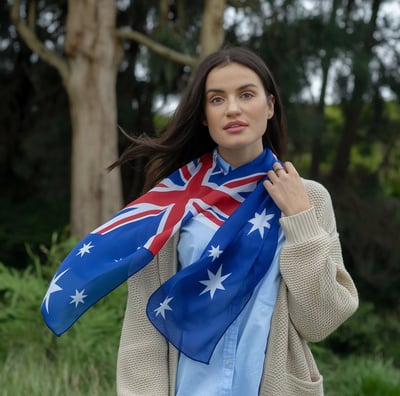 A photo of a woman wearing a digital printed Australian flag chiffon scarf