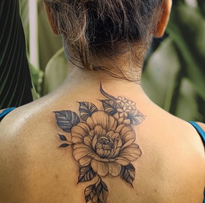 a woman with a tattoo on her back
