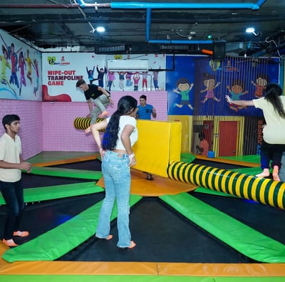a group of people playing with a trampoline trampoline trampoline