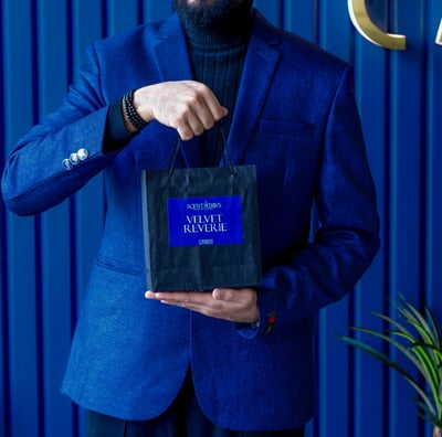 a man in a blue suit and a black suit