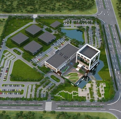 a large building with a lot of trees and a lot of grass