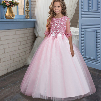a young girl in a pink special occasion party dress with a beautiful sparkling floral bodice
