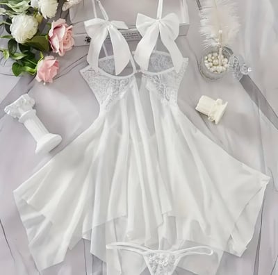 a white dress with a white dress and a bouquet of flowers