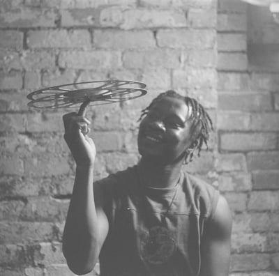 a man holding a film reel smiling
