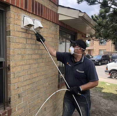technician cleaning dryer vent